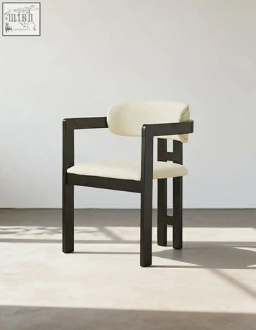 Sara dining chair with sleek black wood frame and cream upholstery perfect for stylish coffee table sets