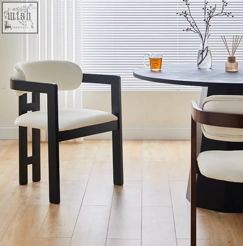 Modern black-framed sara dining chair with cream wood seat perfect for pairing with a coffee table set or table set