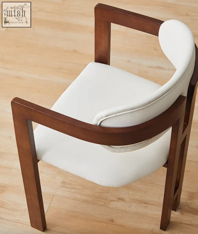 White upholstered sara dining chair with dark wood frame perfect for modern coffee table set or table set setups