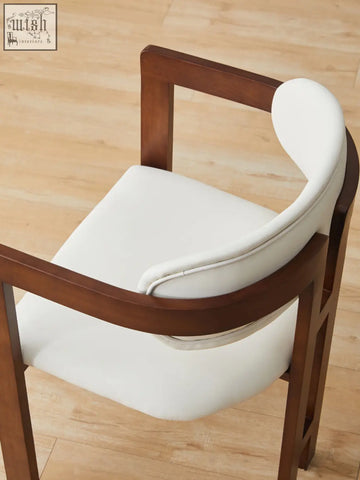 Sara dining chair with white upholstered seat and sleek dark wood frame perfect for stylish coffee table sets