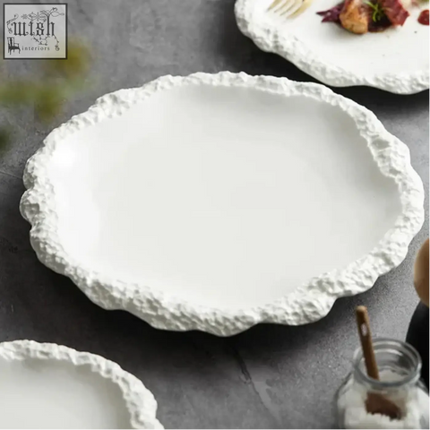 White ceramic sara plates serving platter with scalloped edge and white glaze perfect for modern dining