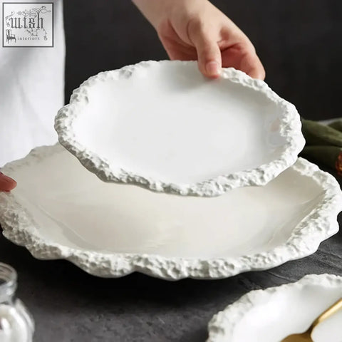 White ceramic sara plates with textured scalloped edge and durable ceramic white glaze perfect for modern dining