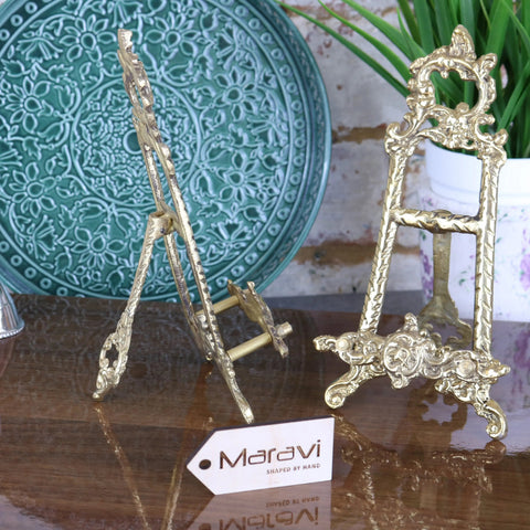 Two ornate hand-shaped brass easels with floral scrollwork from the saramati 20cm brass easel set of 2