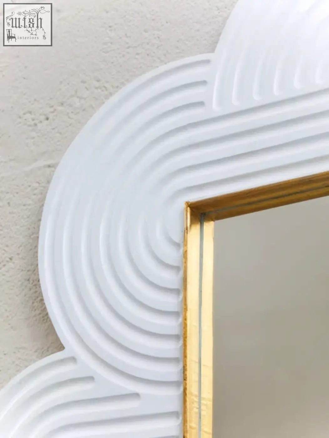 White cloud-shaped wall mirror with gold-trimmed frame and ridged detailing in mango wood finish