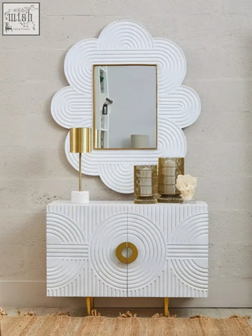 White console table with gold hardware and mango wood wall mirror with concentric circular embossing design