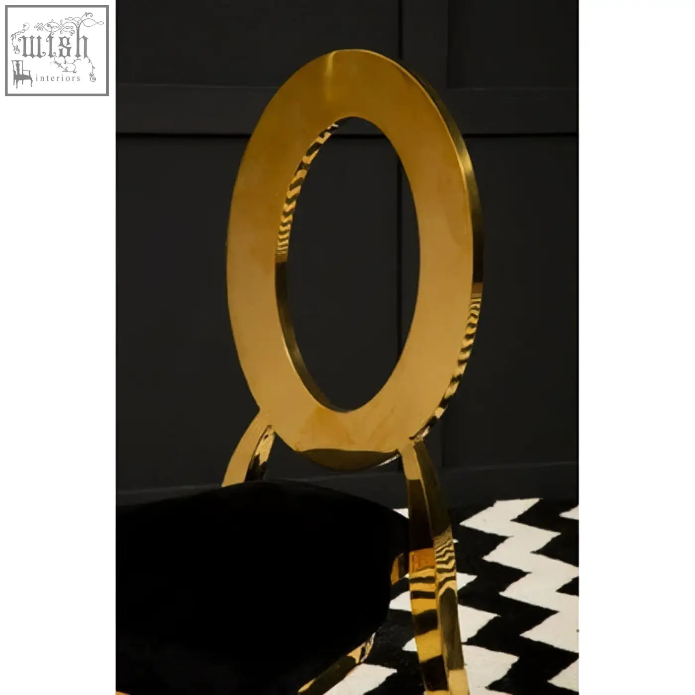 Sarita stackable gold dining chair with a sleek stackable gold frame and black velvet oval-backed seat