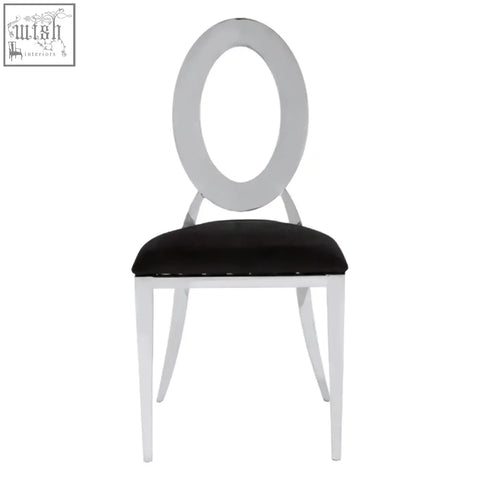 White oval-backed sarita stackable silver dining chair with black velvet padded seat for stylish comfort