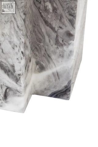 A sleek white marble side table with gray veining and modern geometric design for saronno grey marble dining table
