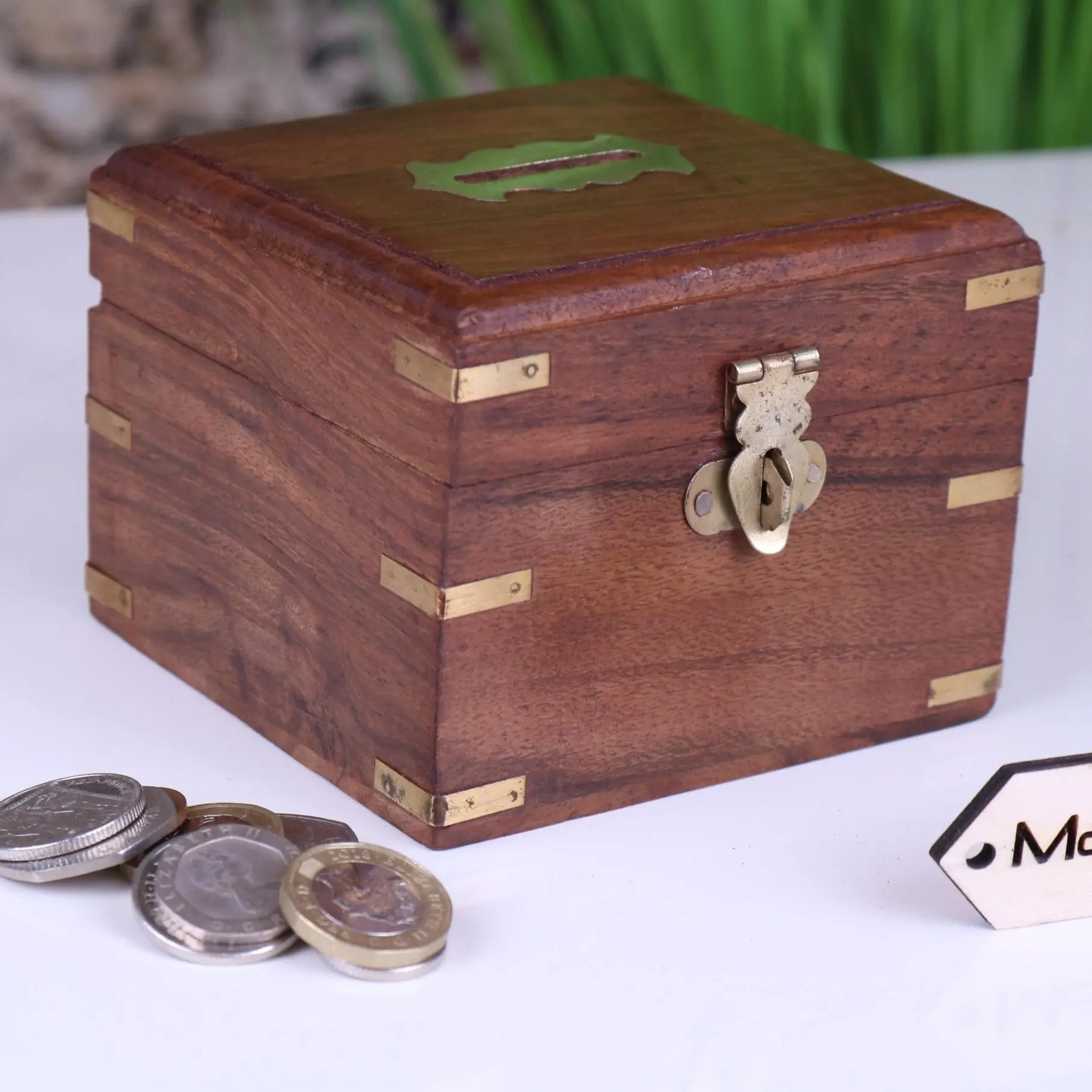 Sasa wooden money box with rustic wood, brass accents, green slot, and decorative keyhole latch for saving wooden money