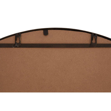 Black metal-framed wall mirror with curved top edge and antique gold finish hanging hardware visible