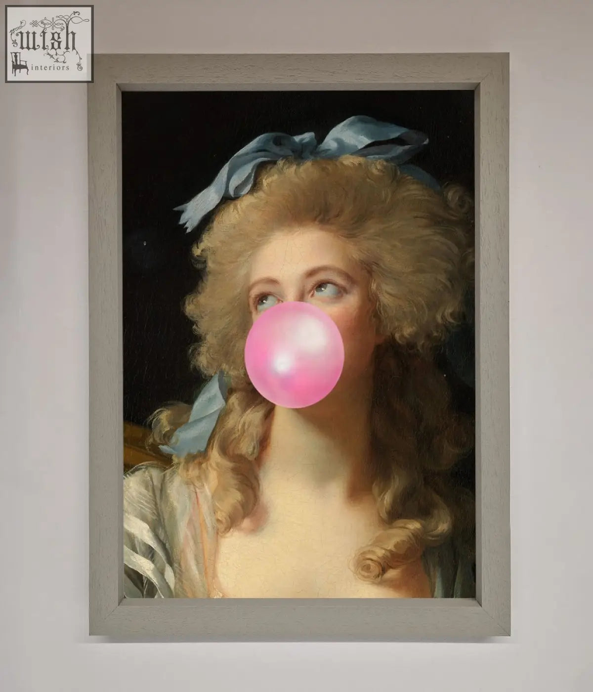 A sass queen framed print featuring a woman with blonde curls and a blue ribbon blowing a bright pink bubblegum bubble