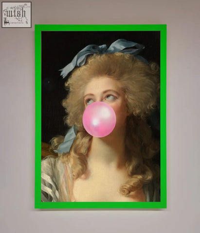 A sass queen framed print showing a woman with curly blonde hair and a blue ribbon blowing a bright pink bubblegum bubble