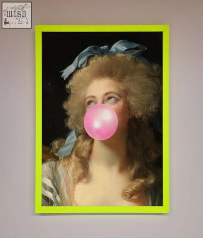 A sass queen framed print with a vibrant lime green frame featuring a woman blowing a bright pink bubblegum bubble