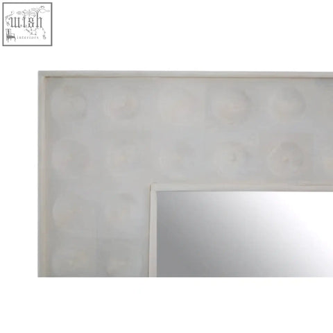 Rectangular satara wall mirror with off-white textured frame featuring subtle circular indentations for stylish decor