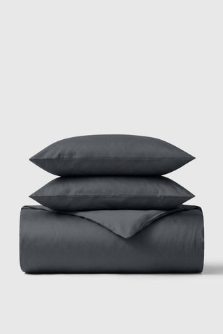 Dark gray smooth-textured cotton sateen duvet cover set with matching pillows perfect for a cozy bedroom look