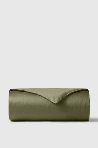 Olive green sateen duvet cover neatly folded showing smooth satin texture perfect for cozy bedding setup