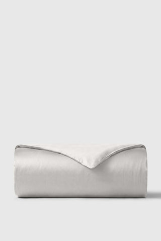 A soft light gray sateen duvet cover with a smooth satin finish and subtle sheen for cozy bedding