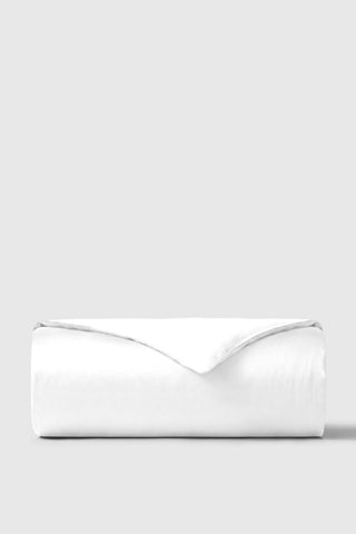 A crisp white sateen duvet cover with a smooth satin-like finish and neatly folded edges