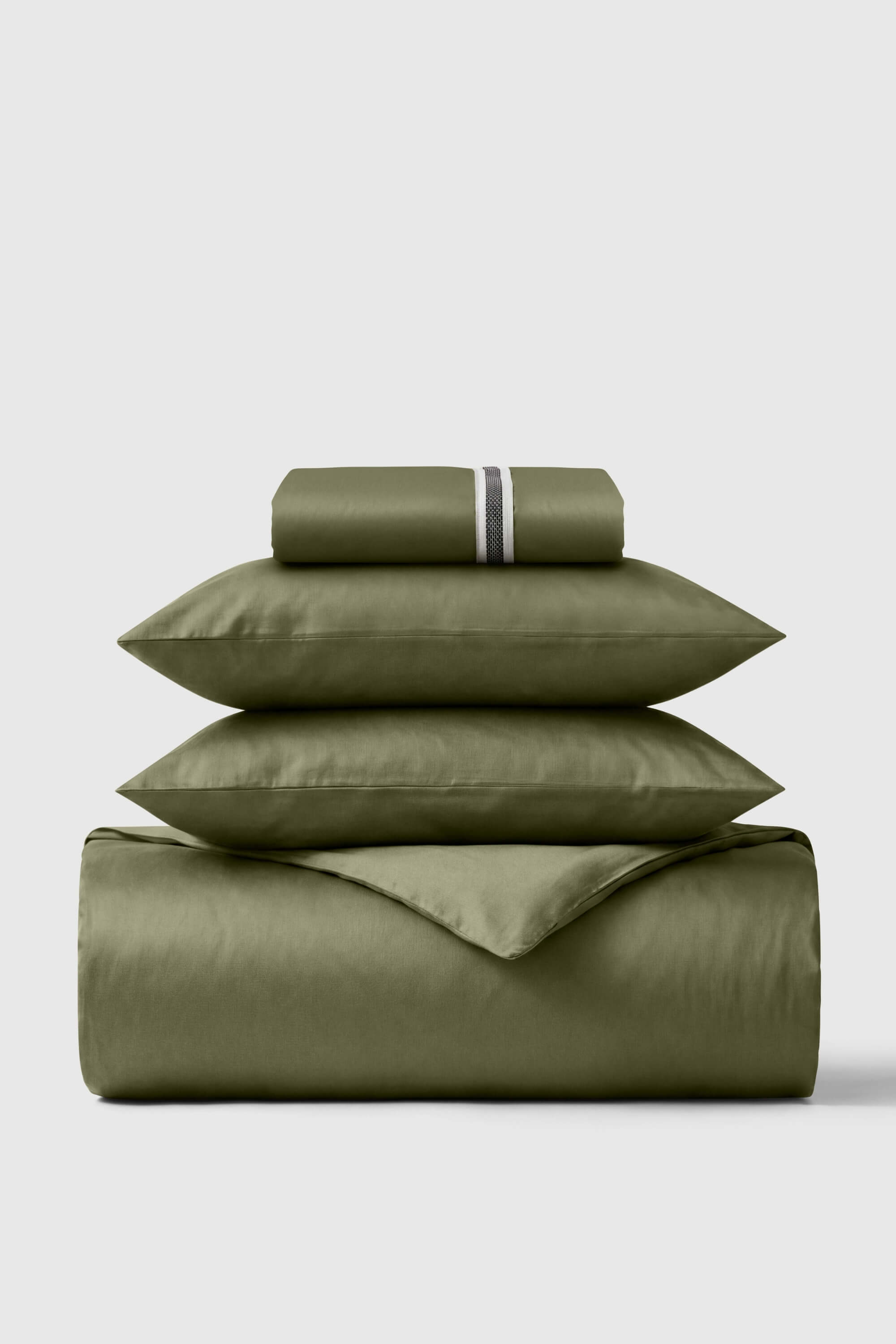 Olive green satin sheet set with subtle striped pillowcase accent in sateen essentials bedding set