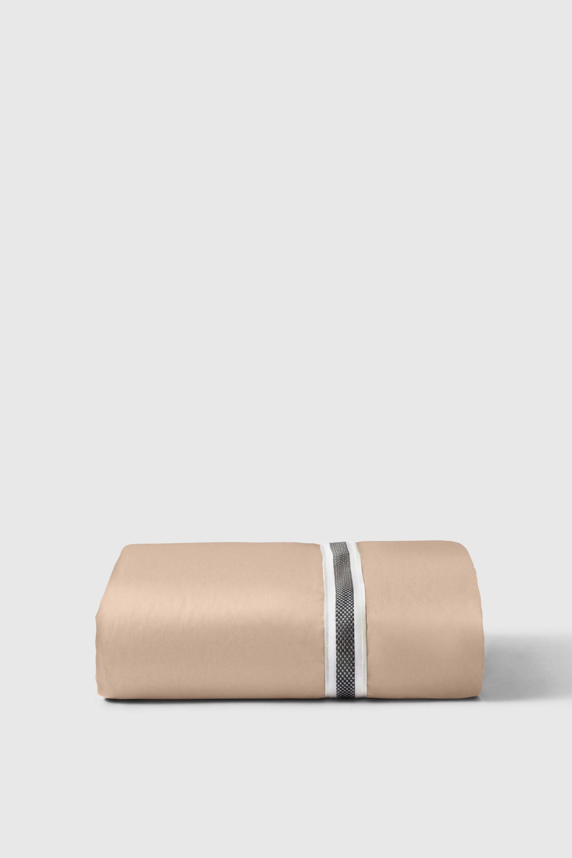Beige cotton sateen fitted sheet with central white and black textured stripe perfect for any bed setup