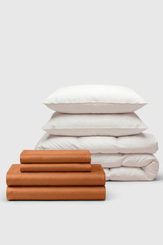 Cinnamon-colored cotton sateen bedding set with matching pillowcases and white duvet perfect for move-in days