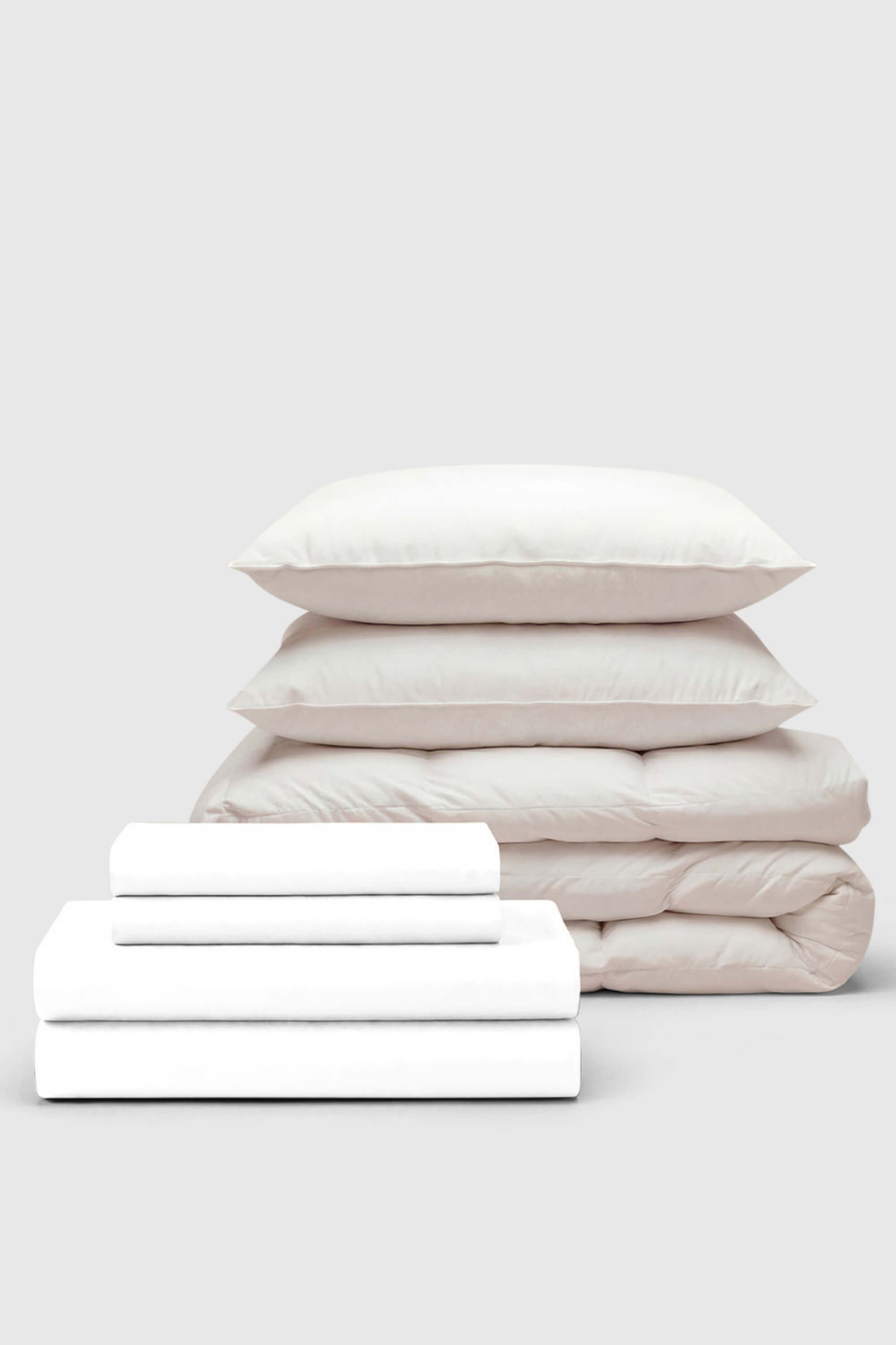White cotton sateen bedding set with matching pillows and quilted duvet perfect for move-in comfort