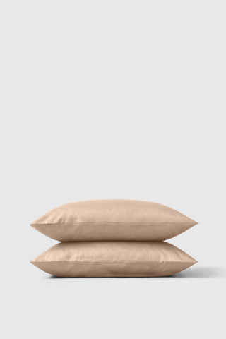Beige sateen pillowcase pair neatly stacked for a soft and smooth bedding upgrade