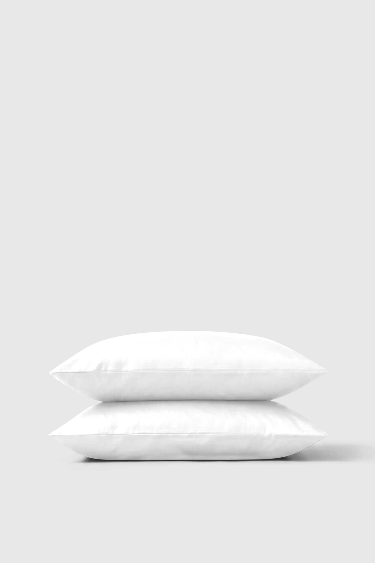White sateen pillowcase pair with smooth slightly glossy fabric finish for a soft luxurious feel