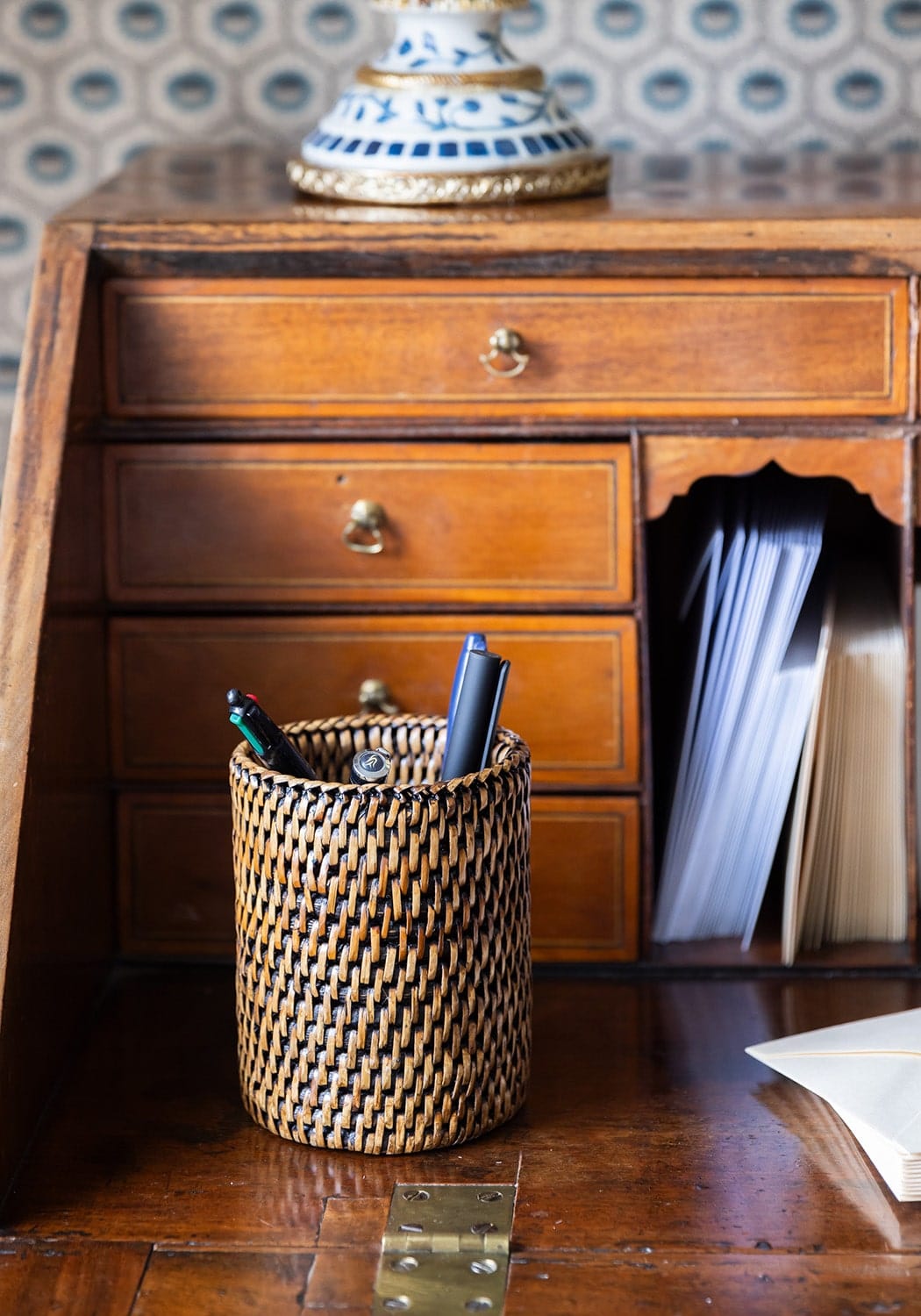 Woven brown and beige cylindrical Savannah pen pot bottle holder made from natural materials for desk organization