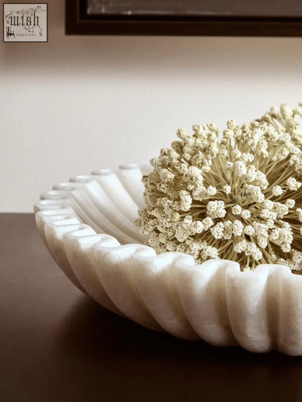 Creamy white marble bowl with fluted rim holding delicate dried flowers perfect for elegant decor display