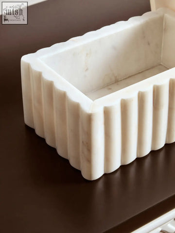 Savio rectangular white marble box with vertical fluted edges and subtle grey veining on an off-white tray