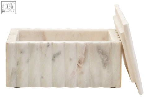 Savio rectangular white marble box with cream color, subtle grey veining, and vertical grooves on its sides