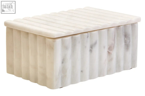 Cream-colored white marble box with vertical ridges and grey veining featuring a matching rectangular lid