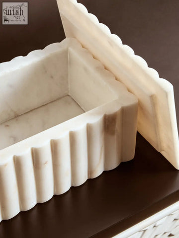 Savio rectangular white marble box with cream color, scalloped edge, vertical ridges, and subtle grey veining