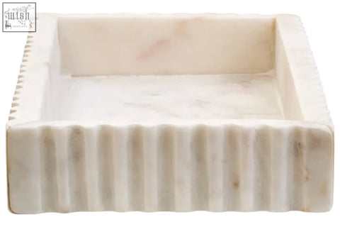 A savio rectangular white marble tray with subtle veining and vertical ridges for a stylish fluted marble tray look