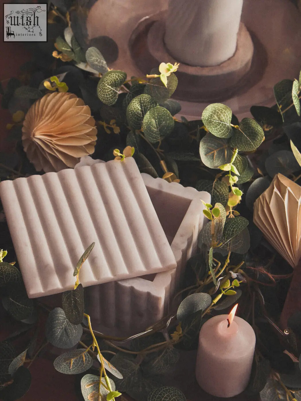 A pale pink fluted marble box with a matching lid from savio square perfect for stylish storage