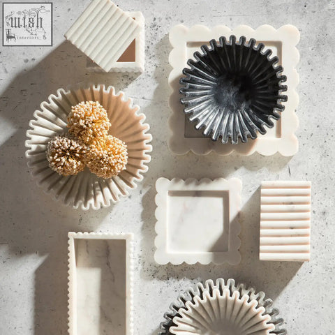 White marble fluted marble box tray with scalloped edges and a black fan-like centerpiece called savio square