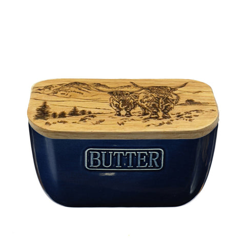 Navy blue ceramic butter dish with wooden lid engraved with scenic highland cow and landscape design