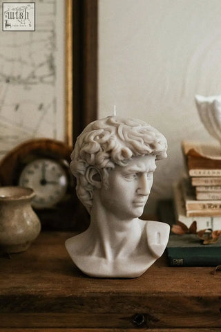 White sculpted scented david bust candle with detailed curly hair and defined facial features bust candle