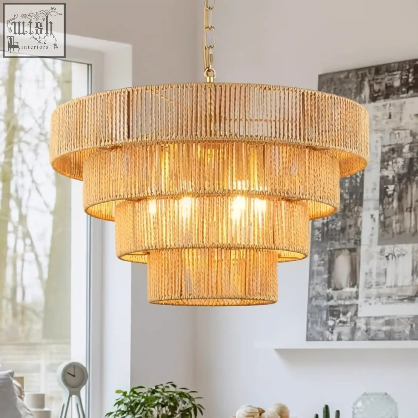 Golden tiered pendant light with woven rattan strands and brass chain perfect for kitchen island lighting