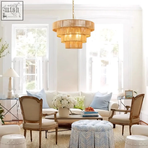 Golden tiered woven rattan pendant light with brass accents perfect for kitchen island or living room lighting