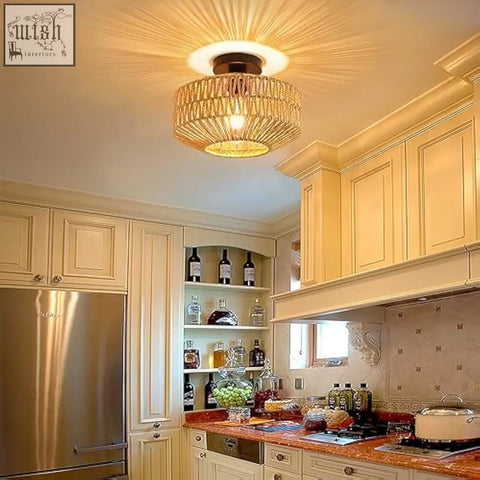 Schindora boho rattan ceiling light with warm golden woven rattan shade and dark metal base for living room use