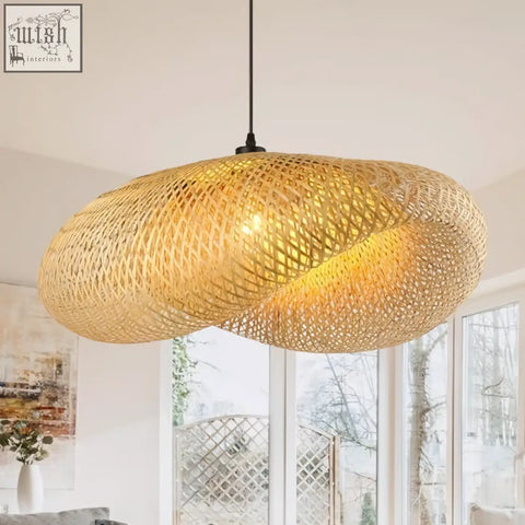 Golden woven bamboo pendant lighting with modern organic design straw hat style perfect for cafe or living room decor