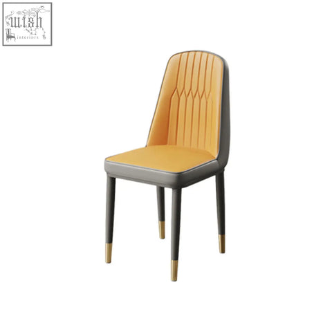 Modern scott dining chair with vibrant orange faux leather upholstery and dark gray metal legs with gold caps