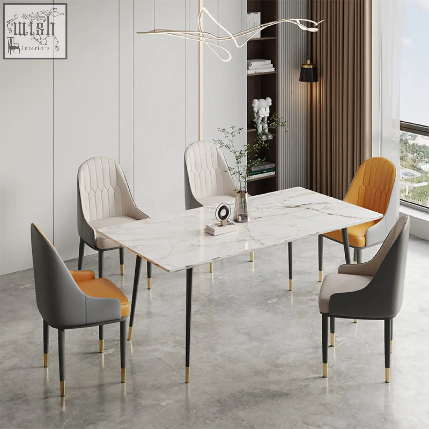 Modern rectangular dining table with white marble top and black legs with gold caps paired with scott dining chair
