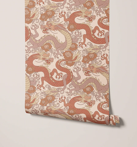 Roll of scute dragon wallpaper with intricate oriental dragon designs in terracotta and beige on cream background