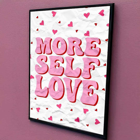 A framed care club print with bold pink and red more self love text on crinkled white background with small hearts
