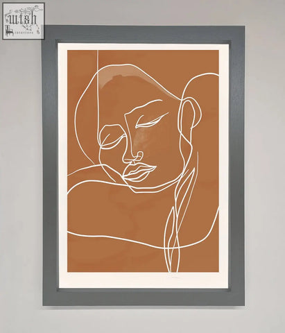 A sepia lines framed wall art featuring minimalist white line art on a terracotta background in a sleek gray frame