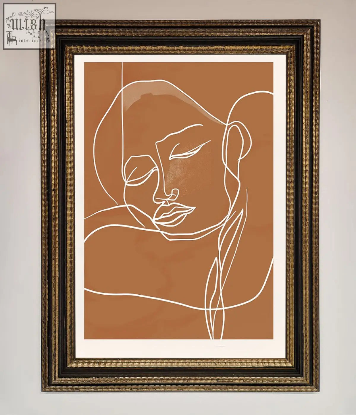 A minimalist line art portrait with white sepia lines framed in dark ornate frame on warm terracotta background wall art
