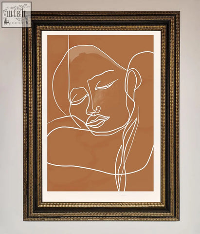 A minimalist line art portrait with white sepia lines framed in dark ornate frame on warm terracotta background wall art
